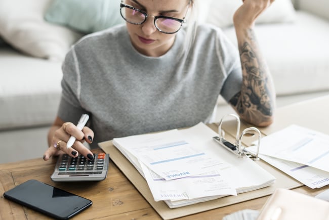 caucasian-woman-with-invoice-bills-scaled