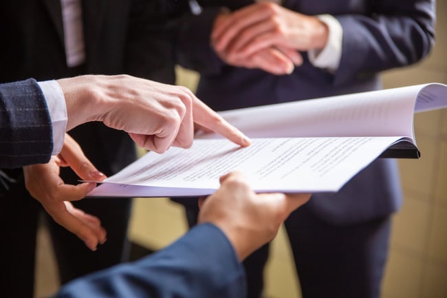cropped-view-of-businesswomen-reading-document-scaled-1