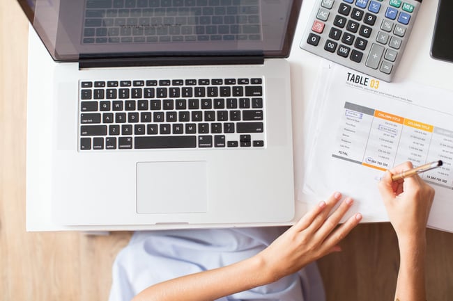 cropped-view-of-woman-working-with-document-1-scaled