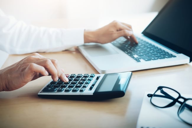 finances-saving-economy-concept-female-accountant-or-banker-use-calculator-scaled