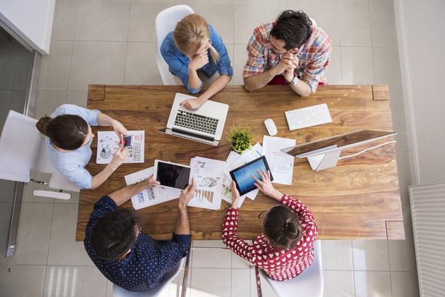 top-view-coworkers-team-working-at-office-scaled