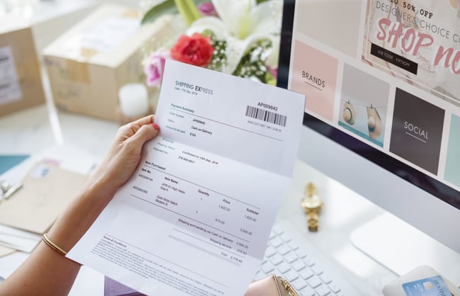 woman-reading-payment-bill-scaled