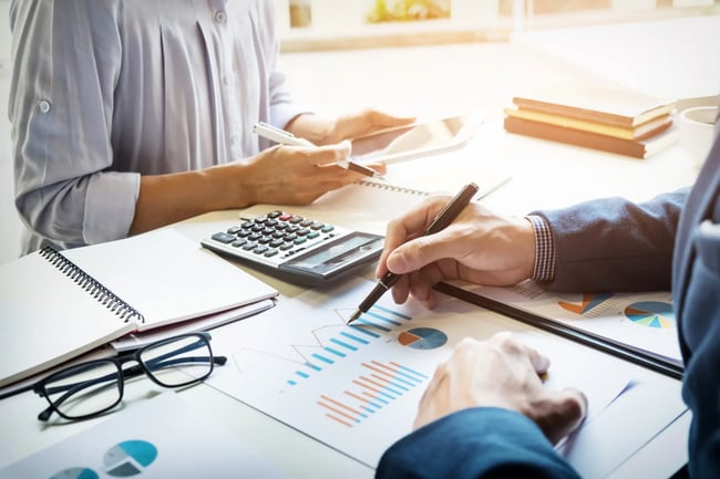 business-man-financial-inspector-and-secretary-making-report-calculating-or-checking-balance-internal-revenue-service-inspector-checking-document-audit-concept-scaled