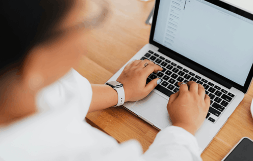 a woman sitting at a computer