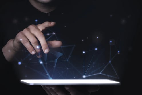 man-using-digital-tablet-psd-mockup-smart-technology-scaled