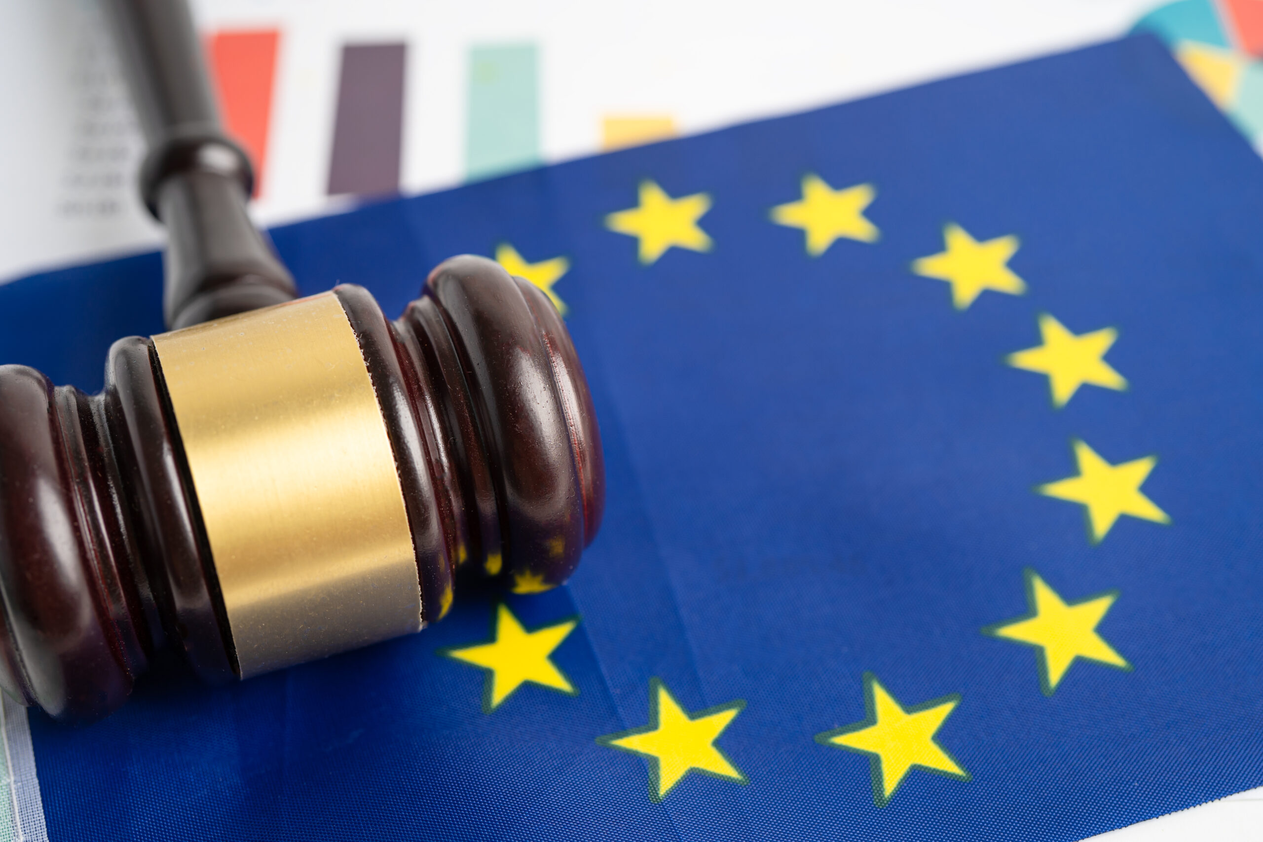 eu-flag-with-gavel-on-graph-for-judge-lawyer-law-and-justice-court-concept-scaled