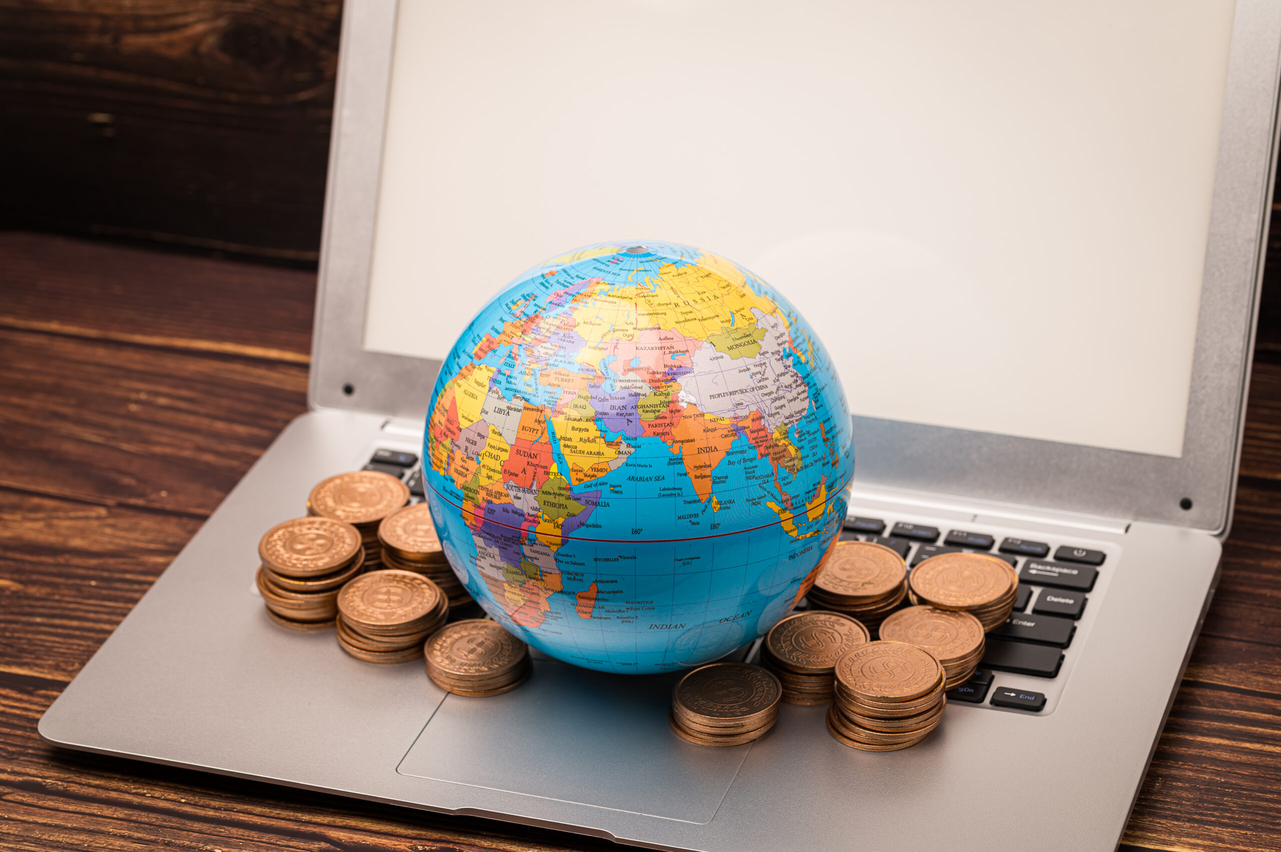 high-angle-view-coins-table-scaled