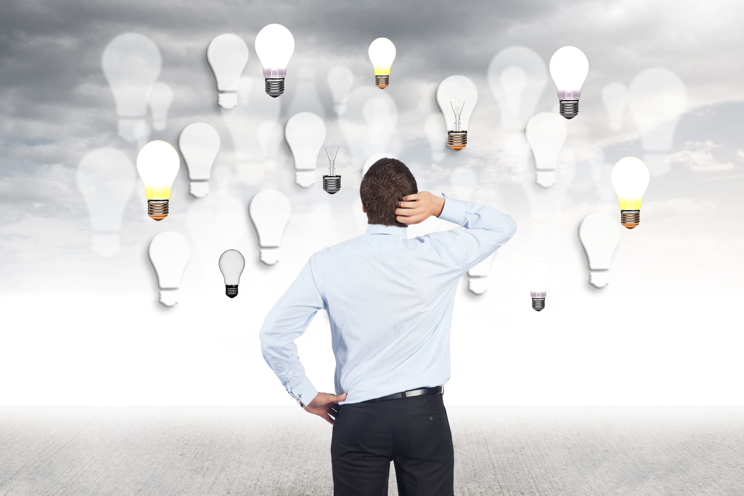 man-touching-her-head-and-looking-bulbs-scaled