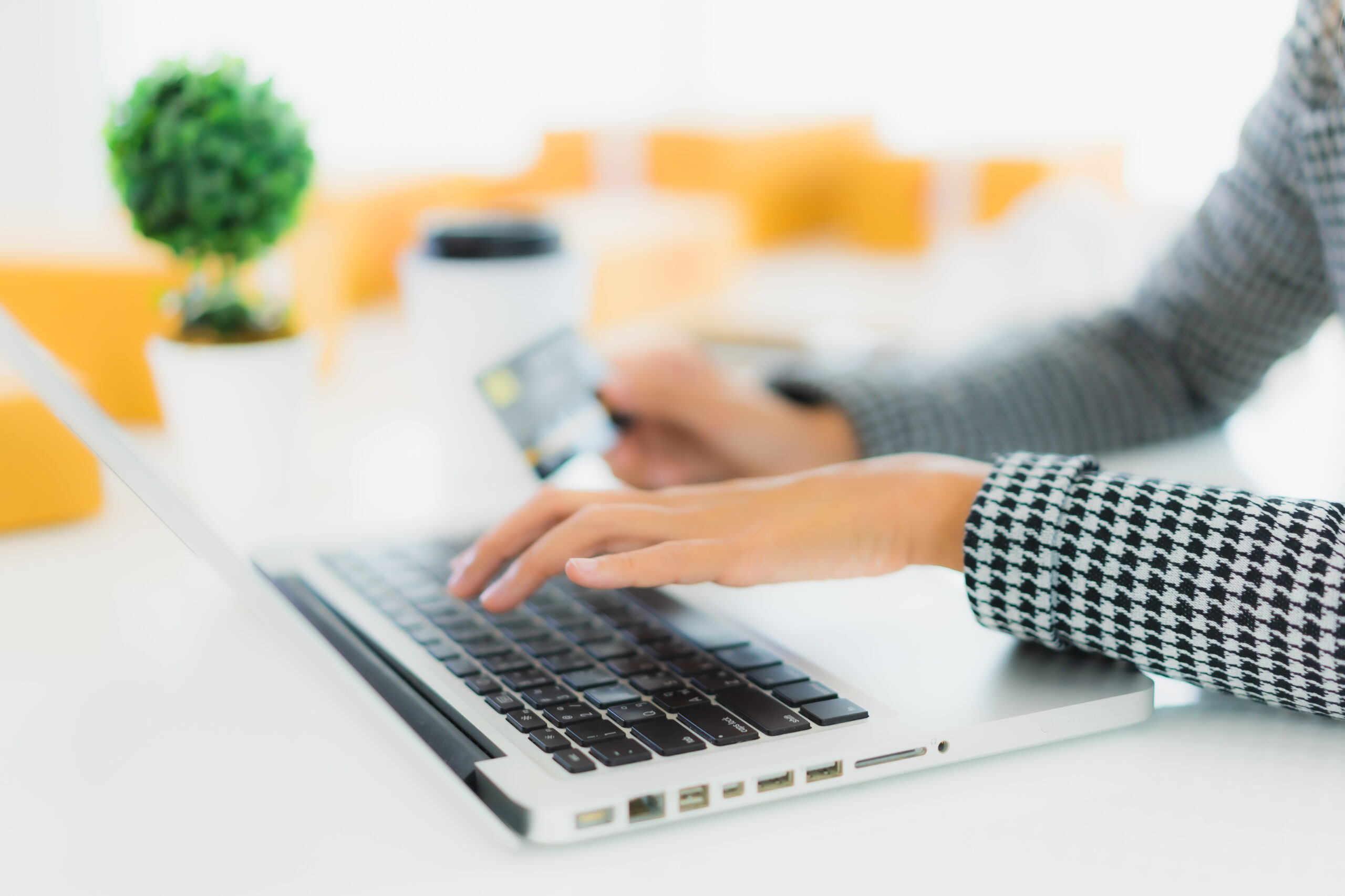 portrait-beautiful-young-asian-woman-use-credit-card-with-laptop-for-online-shopping-scaled