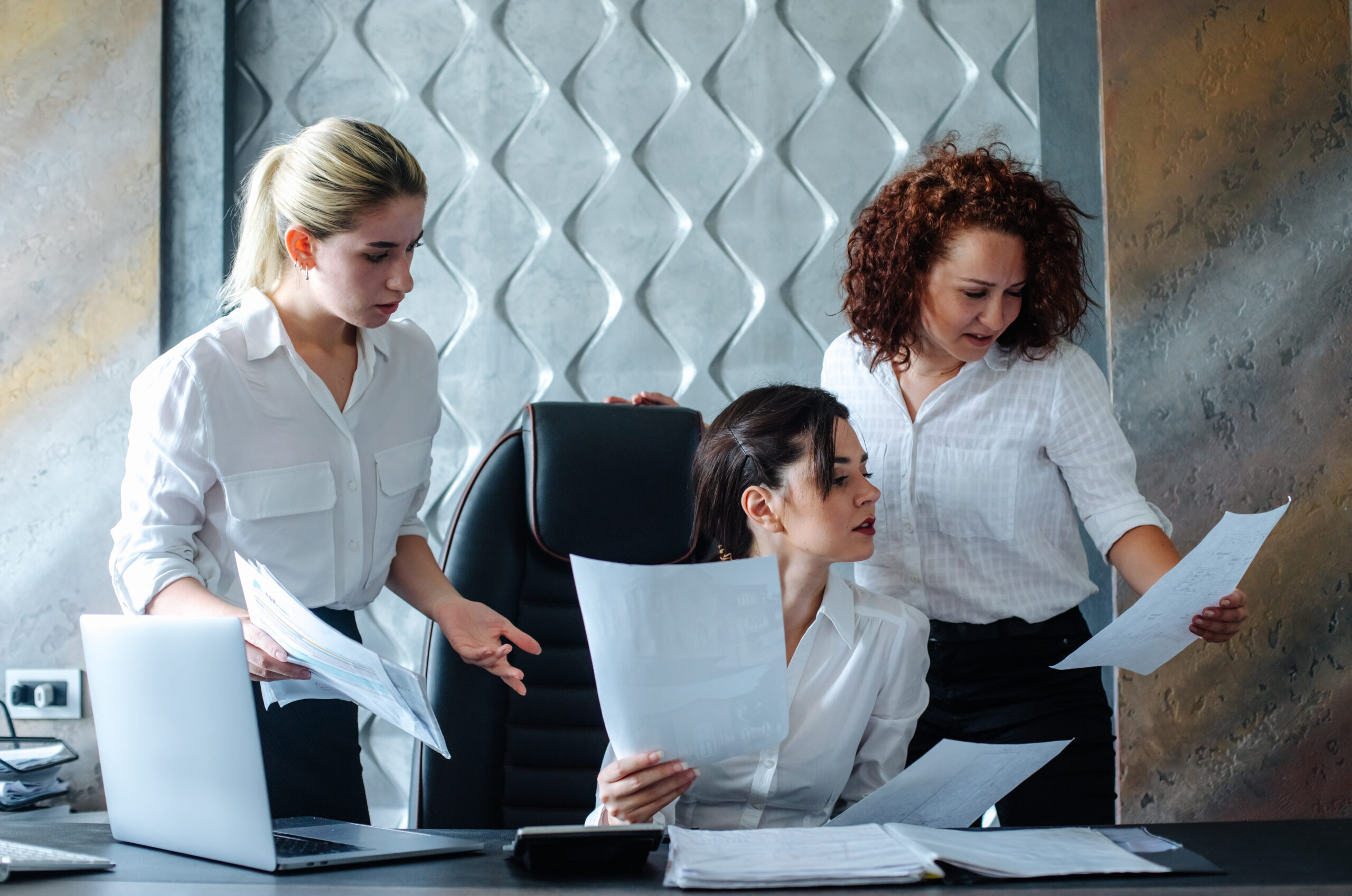 young-business-lady-female-director-sitting-office-desk-using-laptop-computer-working-process-business-meeting-working-with-colleagues-solving-busine