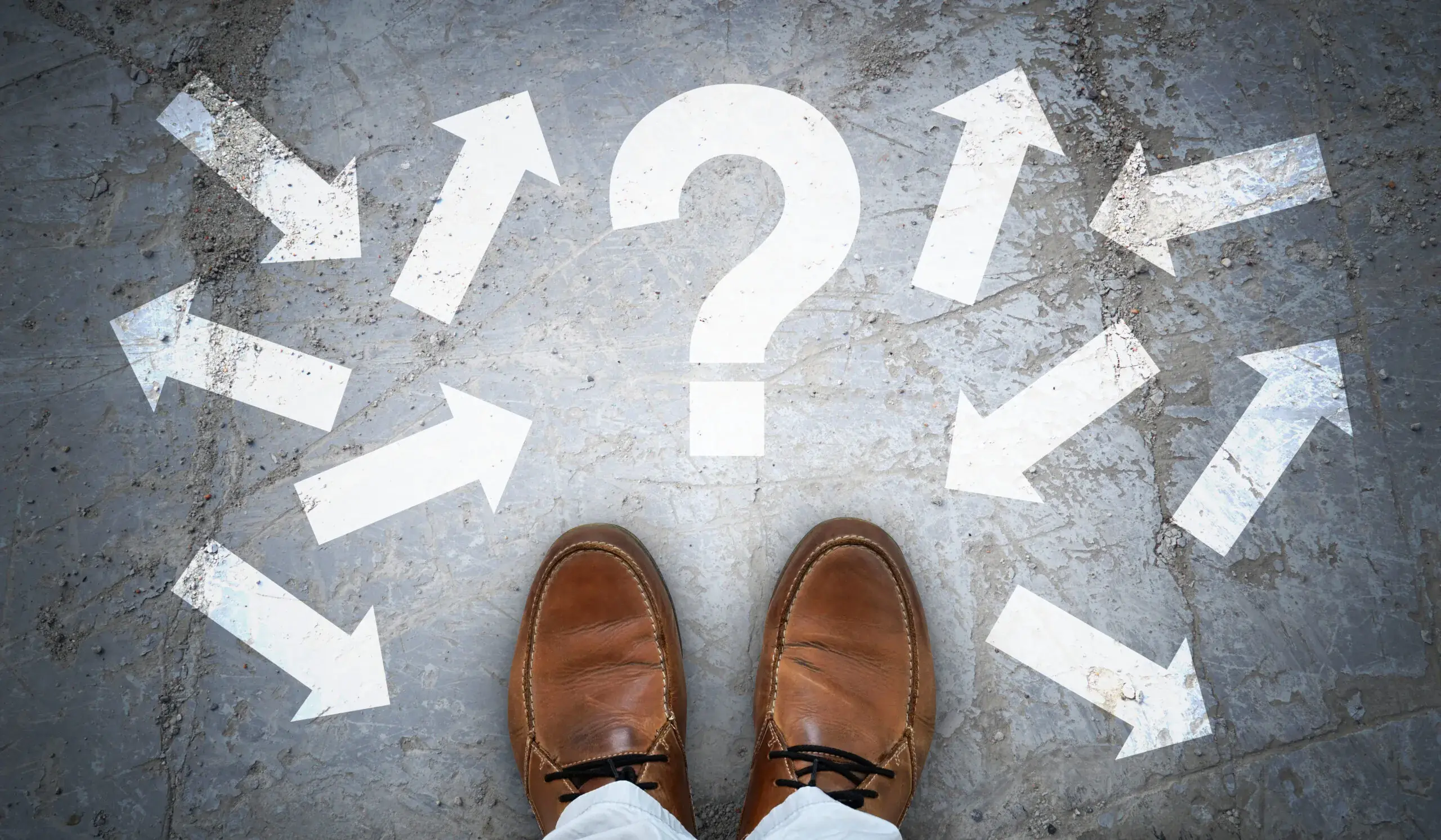 brown-leather-shoes-question-mark-many-arrows-chaos-concept-scaled