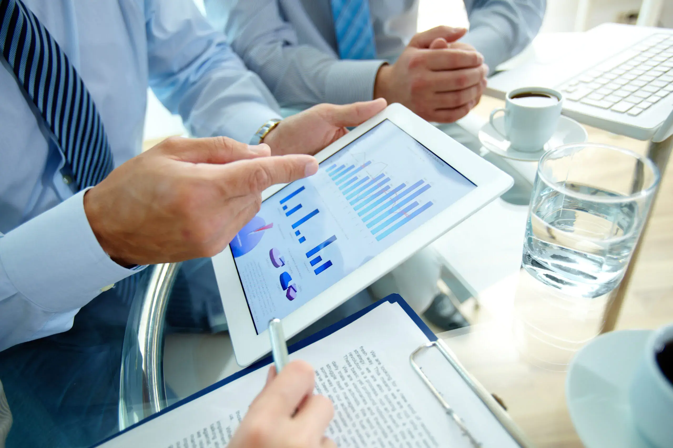 close-up-of-executive-pointing-to-a-graph-scaled