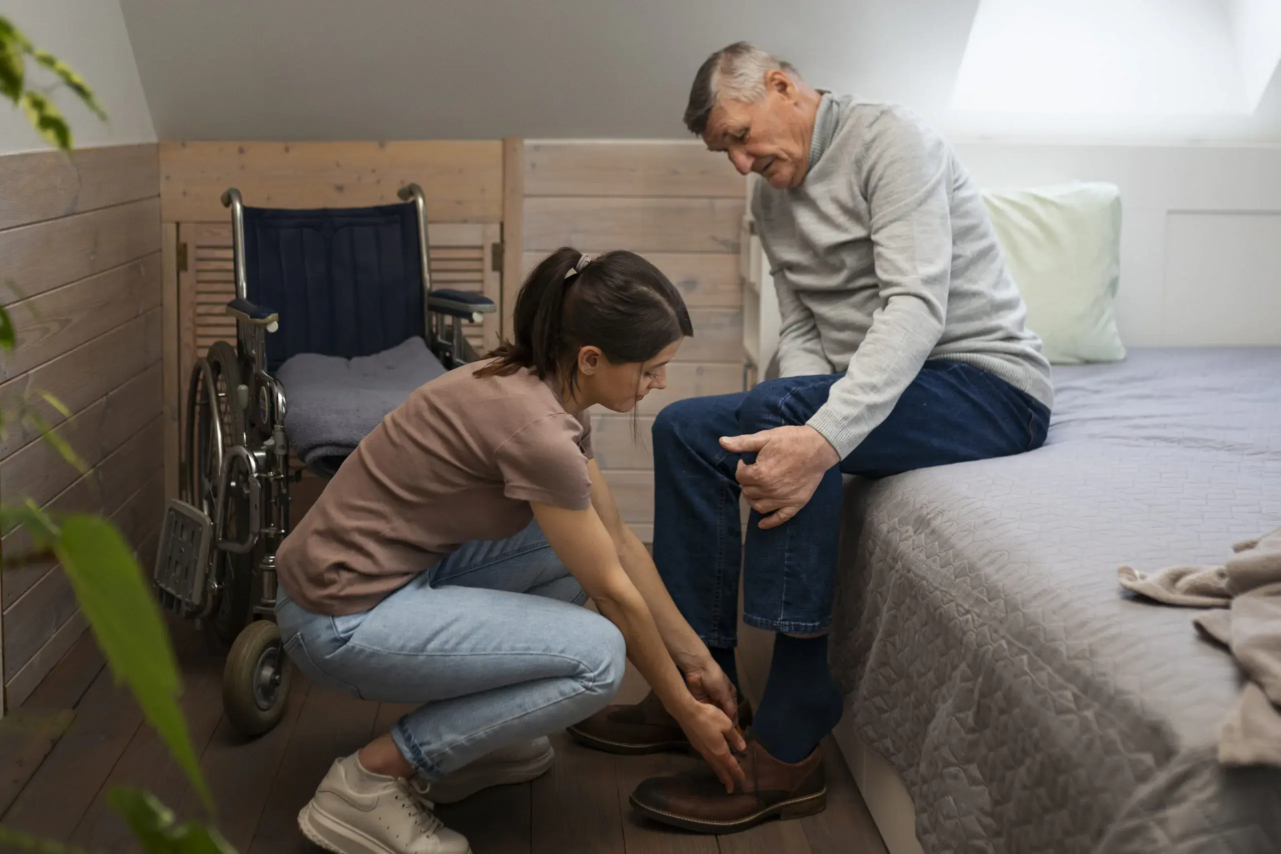 elderly-person-being-taken-care-by-female-caretaker-scaled