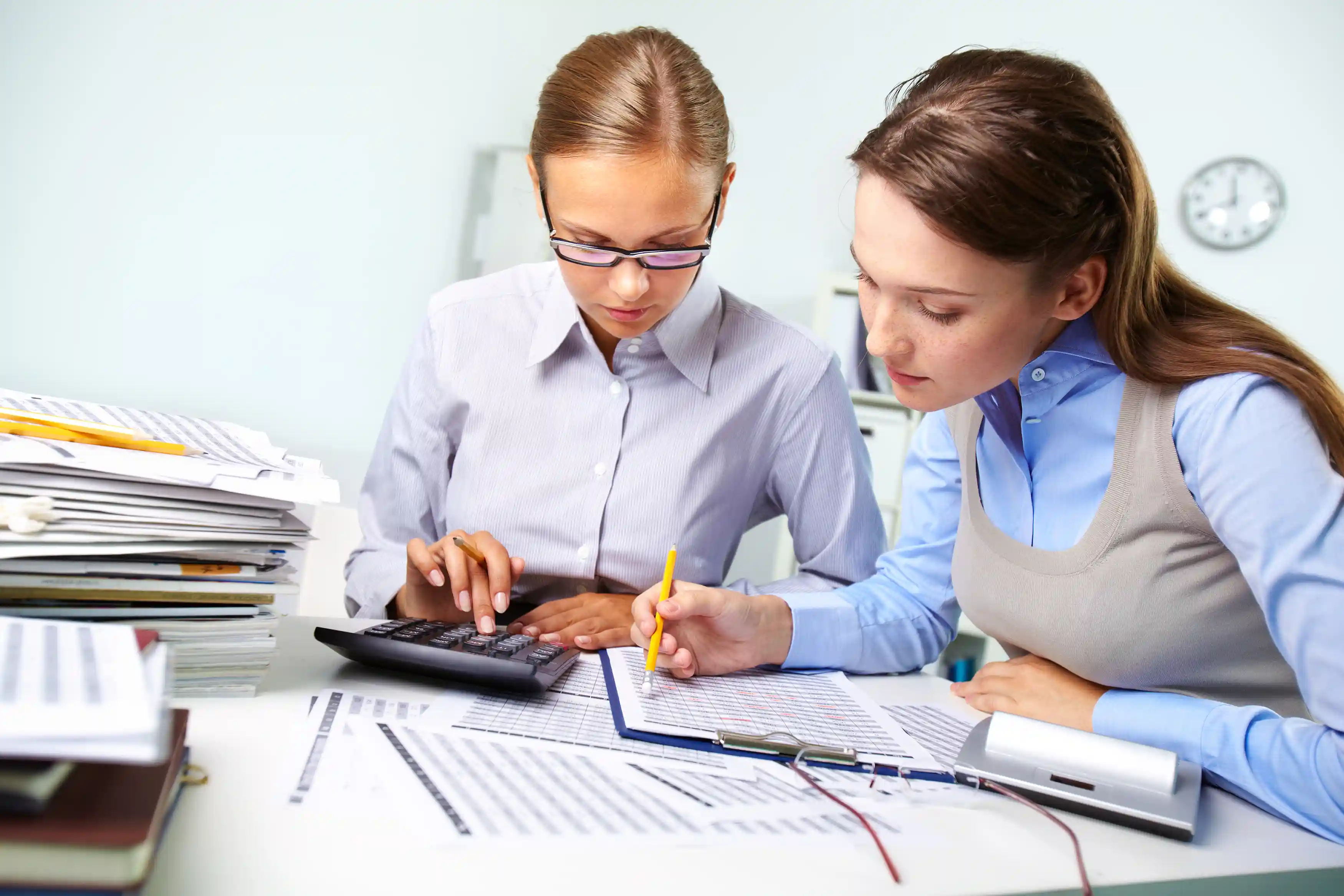 women analyzing documents